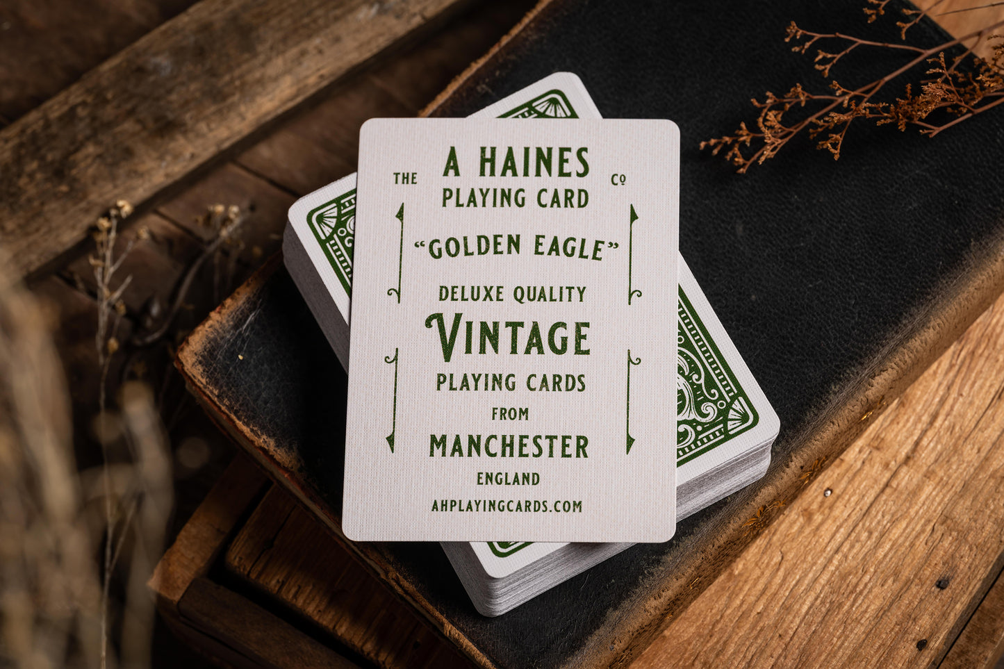 vintage playing cards on antique book