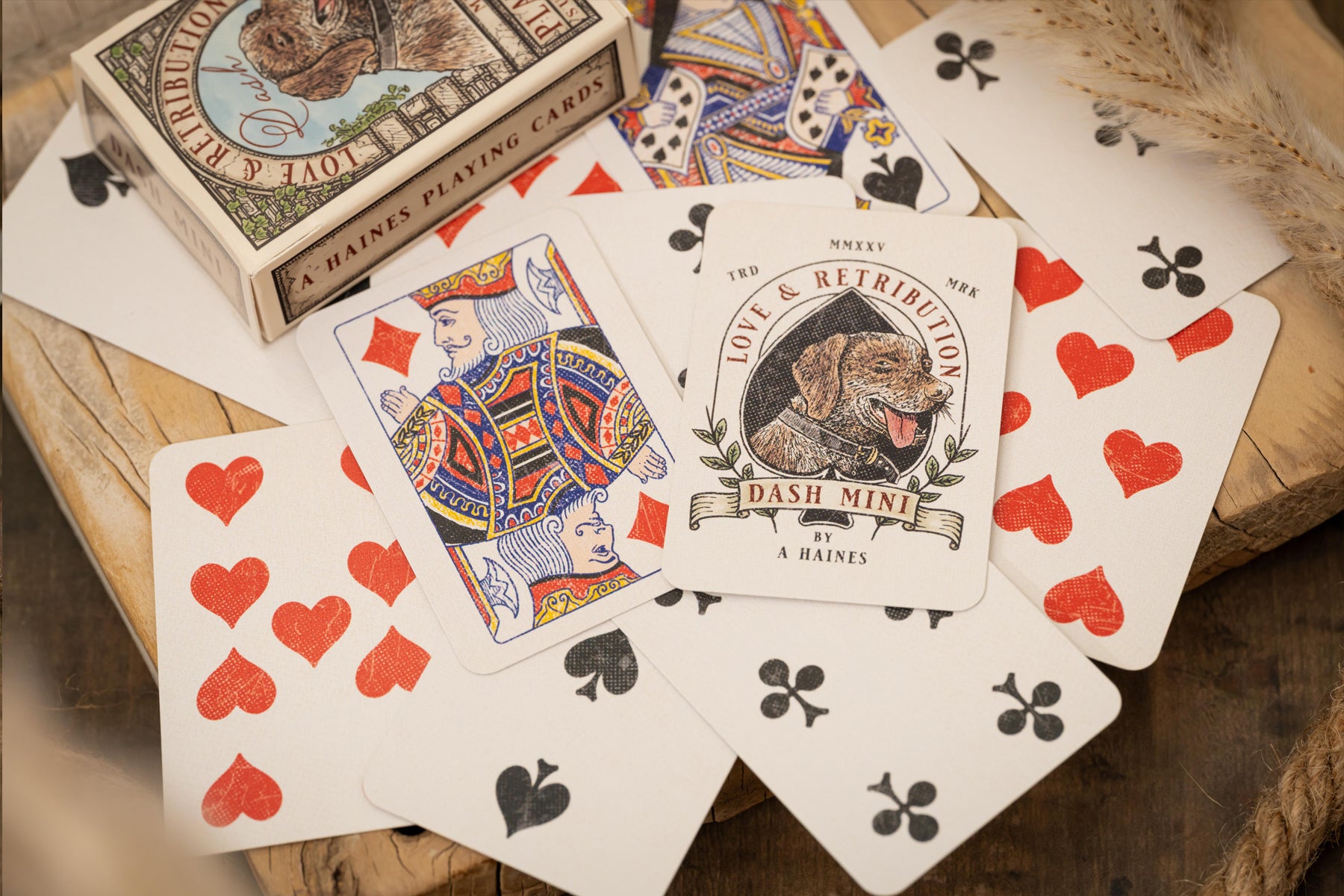 Playing cards with a vintage design on a wooden surface