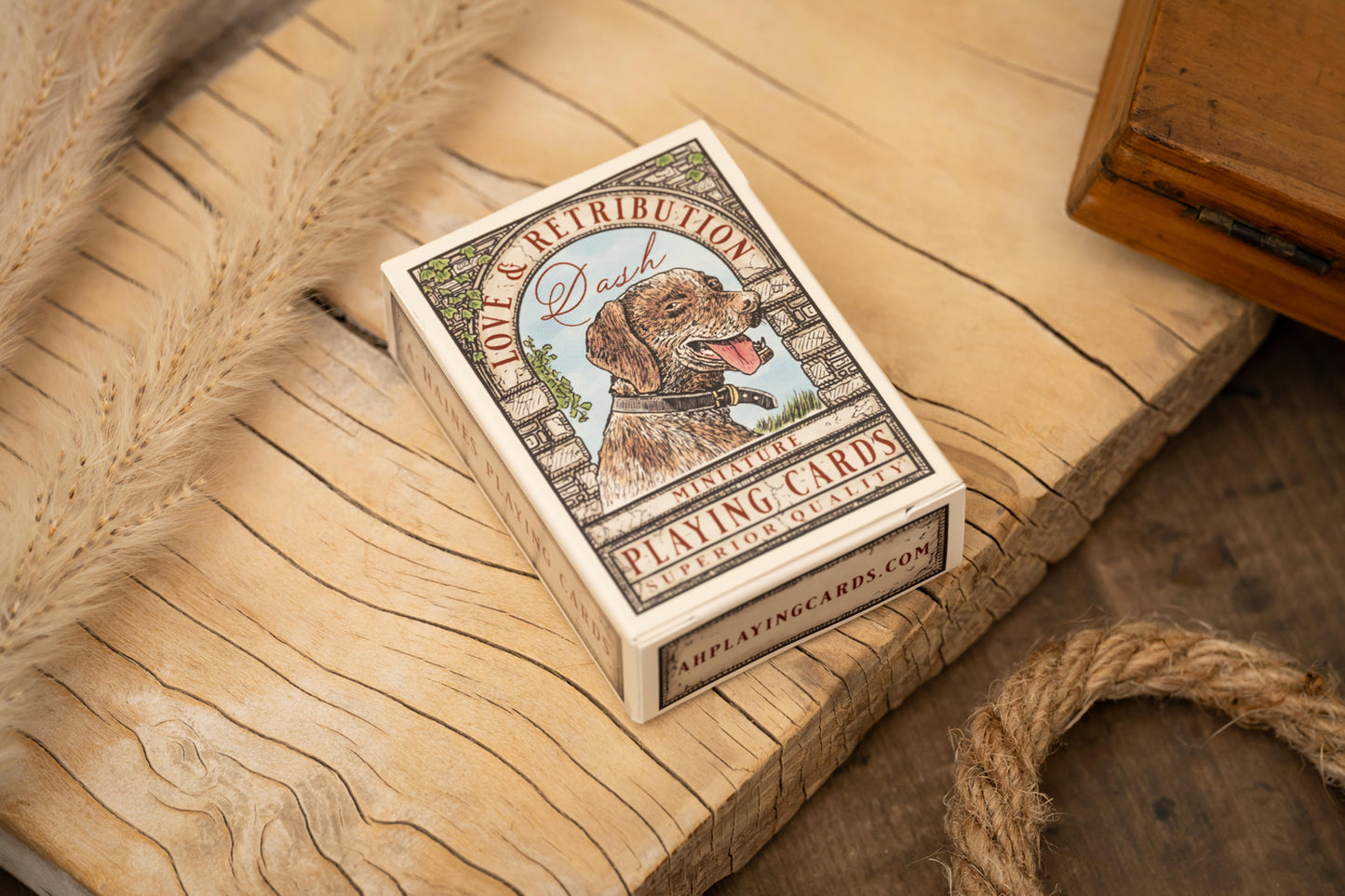 Playing card deck with a dog illustration on a wooden surface