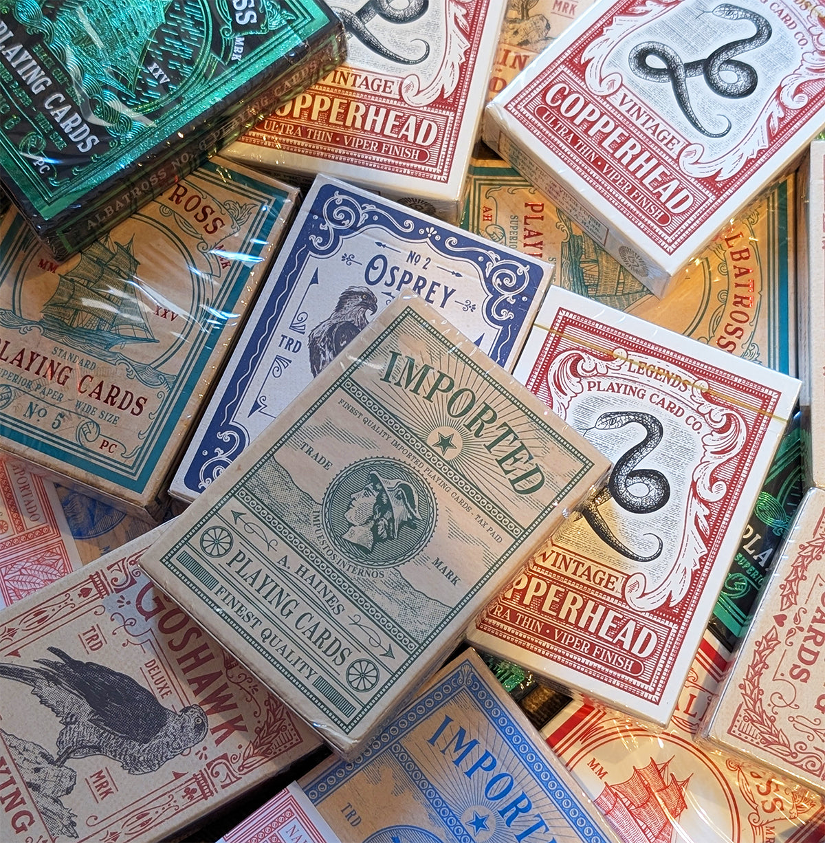 A collection of vintage style premium playing cards - lightly damaged decks - perfect for magic, sleight of hand or cardistry practice