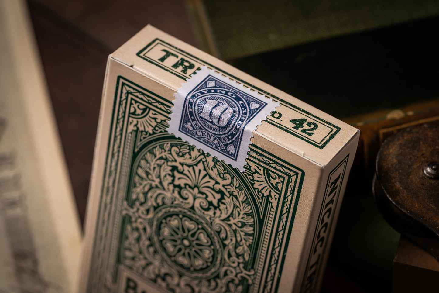 Close-up of a deck of playing cards with intricate design and visible branding.