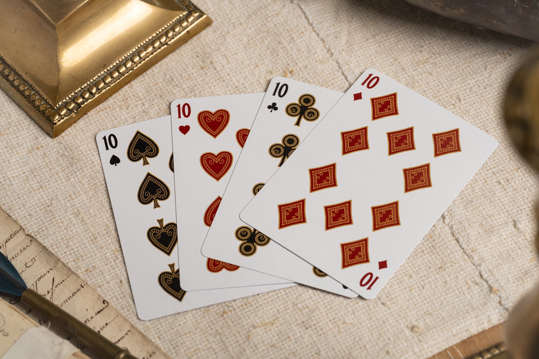 luxury the card inn clubhouse classic elegant playing cards | embossed and foiled boxes | cold foil backs | premium playing cards designed by A. Haines