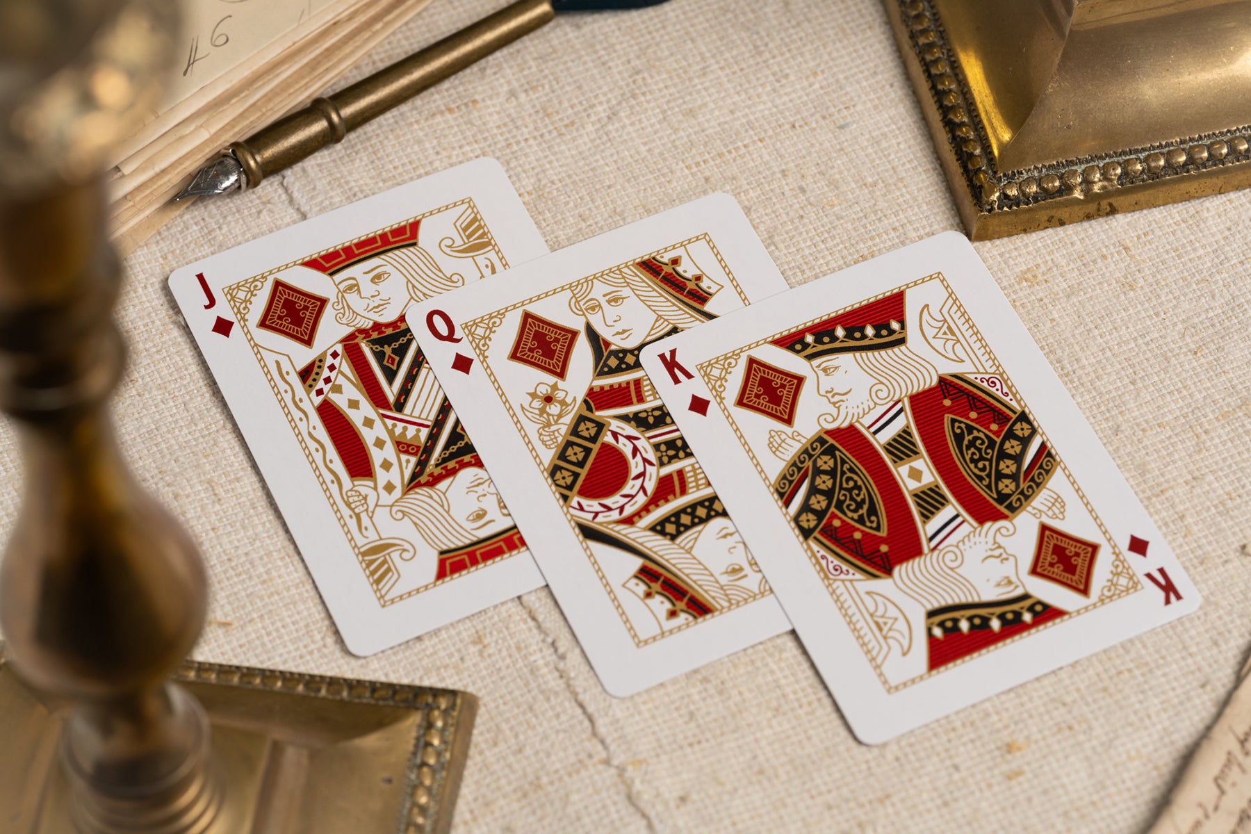 diamond courts | luxury the card inn clubhouse classic elegant playing cards | embossed and foiled boxes | cold foil backs | premium playing cards designed by A. Haines