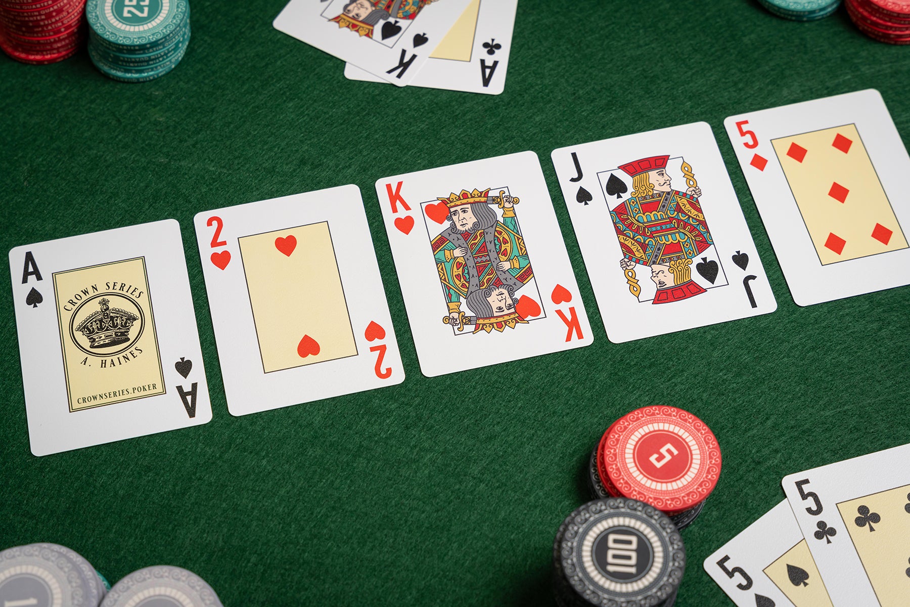 a hand of poker -  the flop - crown series poker plastic playing cards