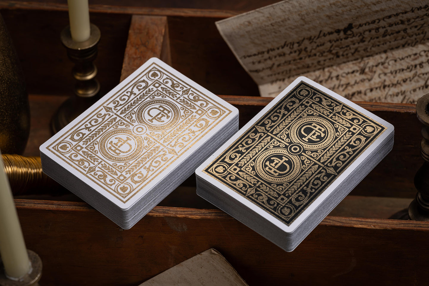 two packs of cards | luxury the card inn clubhouse classic elegant playing cards | embossed and foiled boxes | cold foil backs | premium playing cards designed by A. Haines