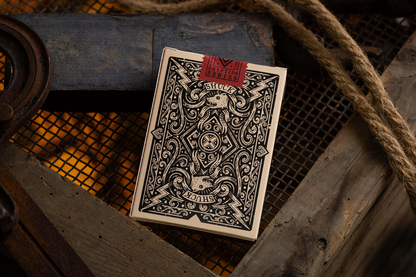 vintage Playing card tuckbox with intricate design on a rustic background