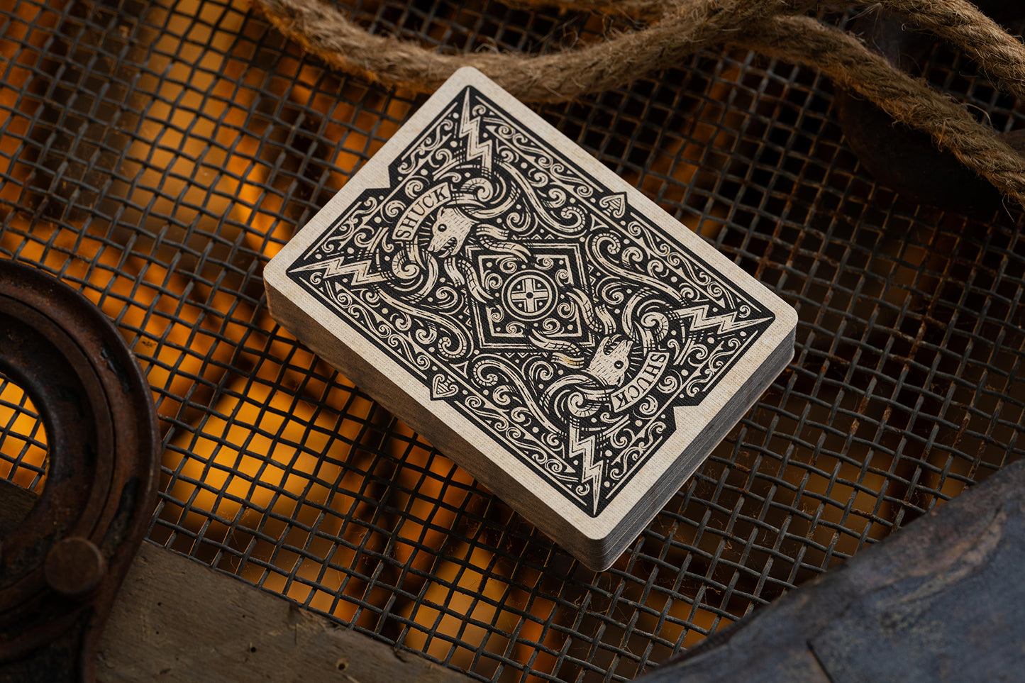 Playing cards with intricate classic design on a textured surface