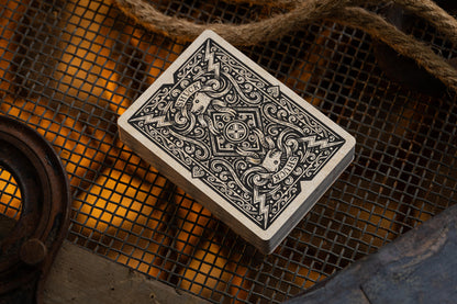 Playing cards with intricate classic design on a textured surface