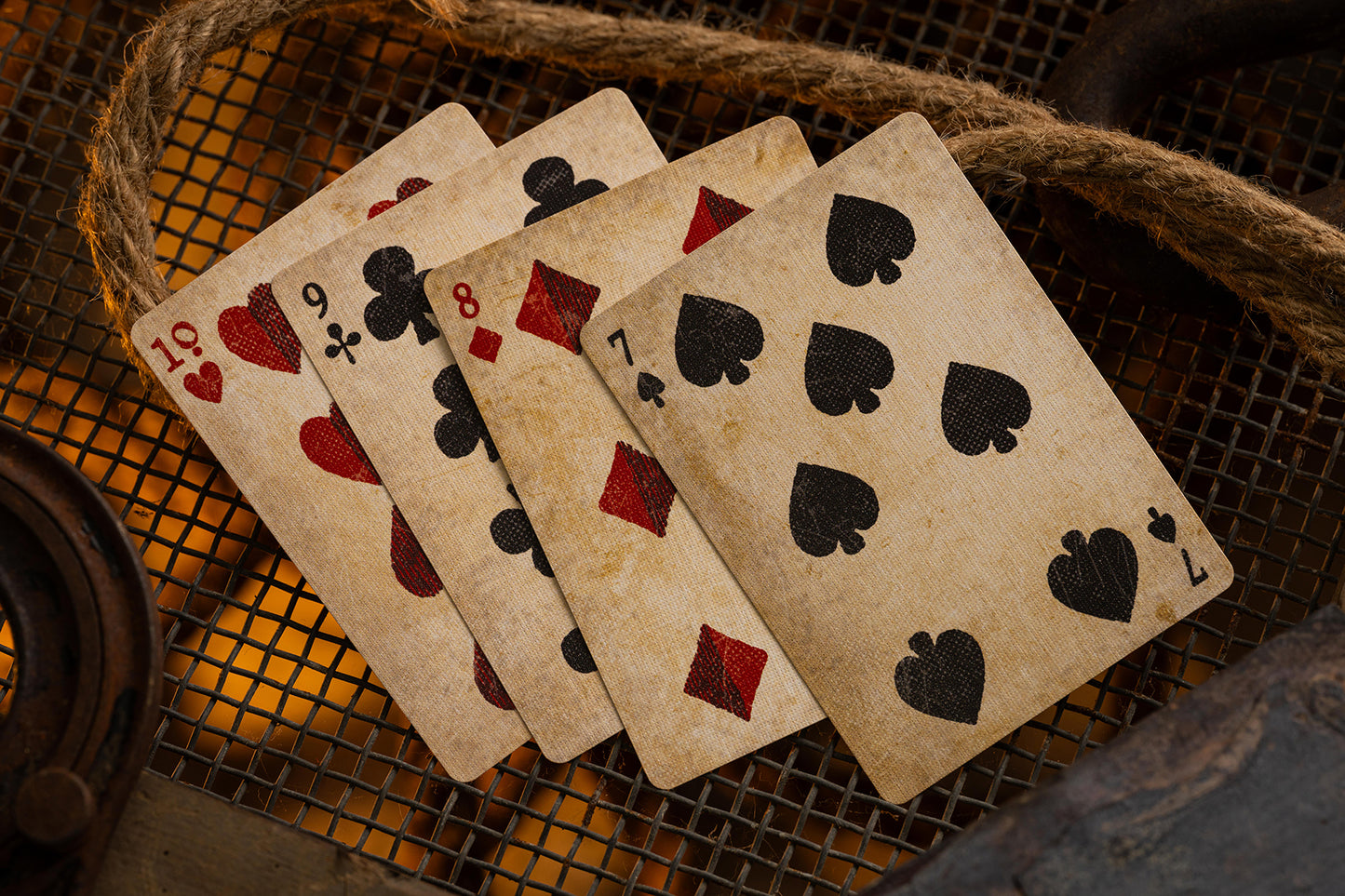 Vintage playing cards on a textured surface
