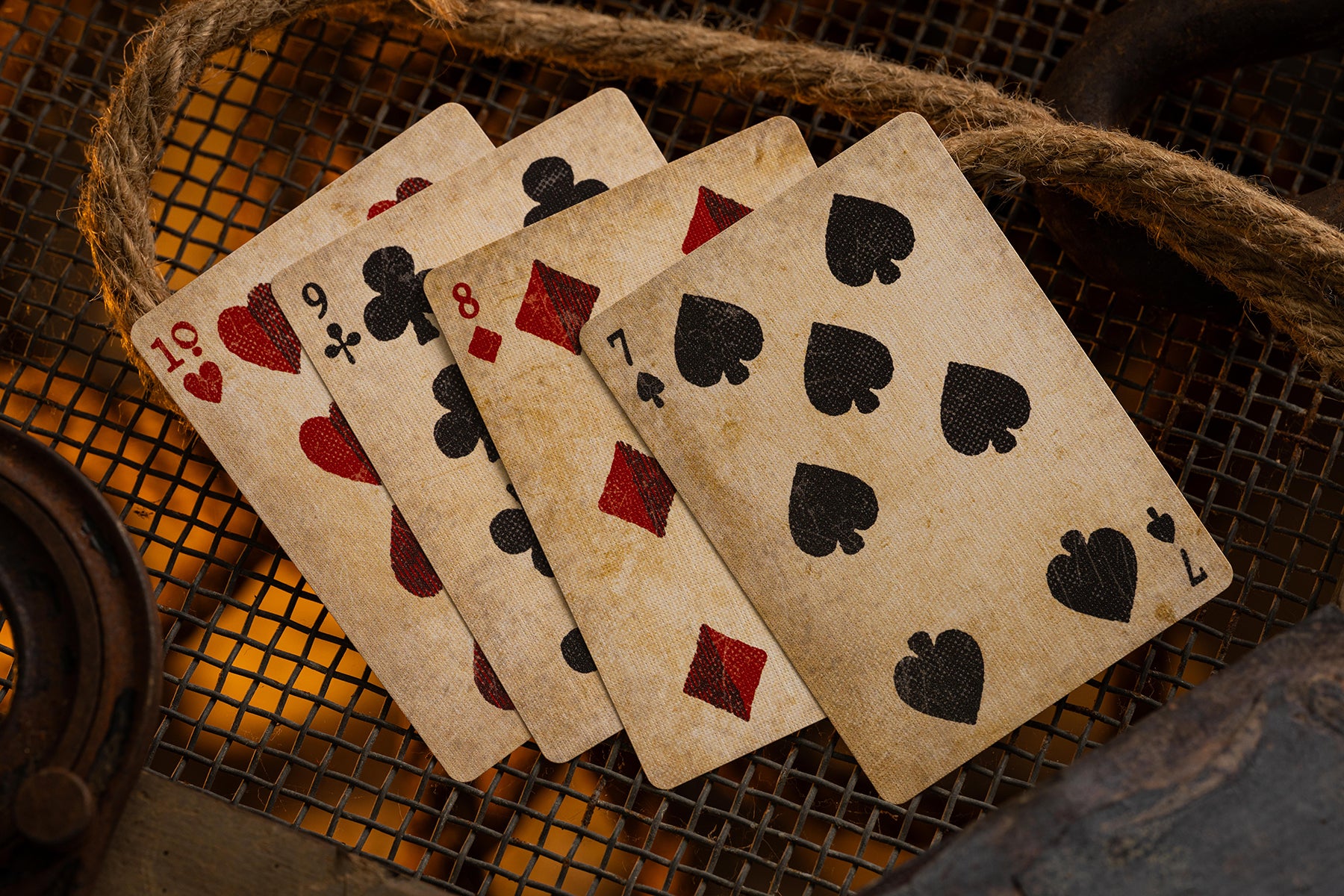 Vintage playing cards on a textured surface