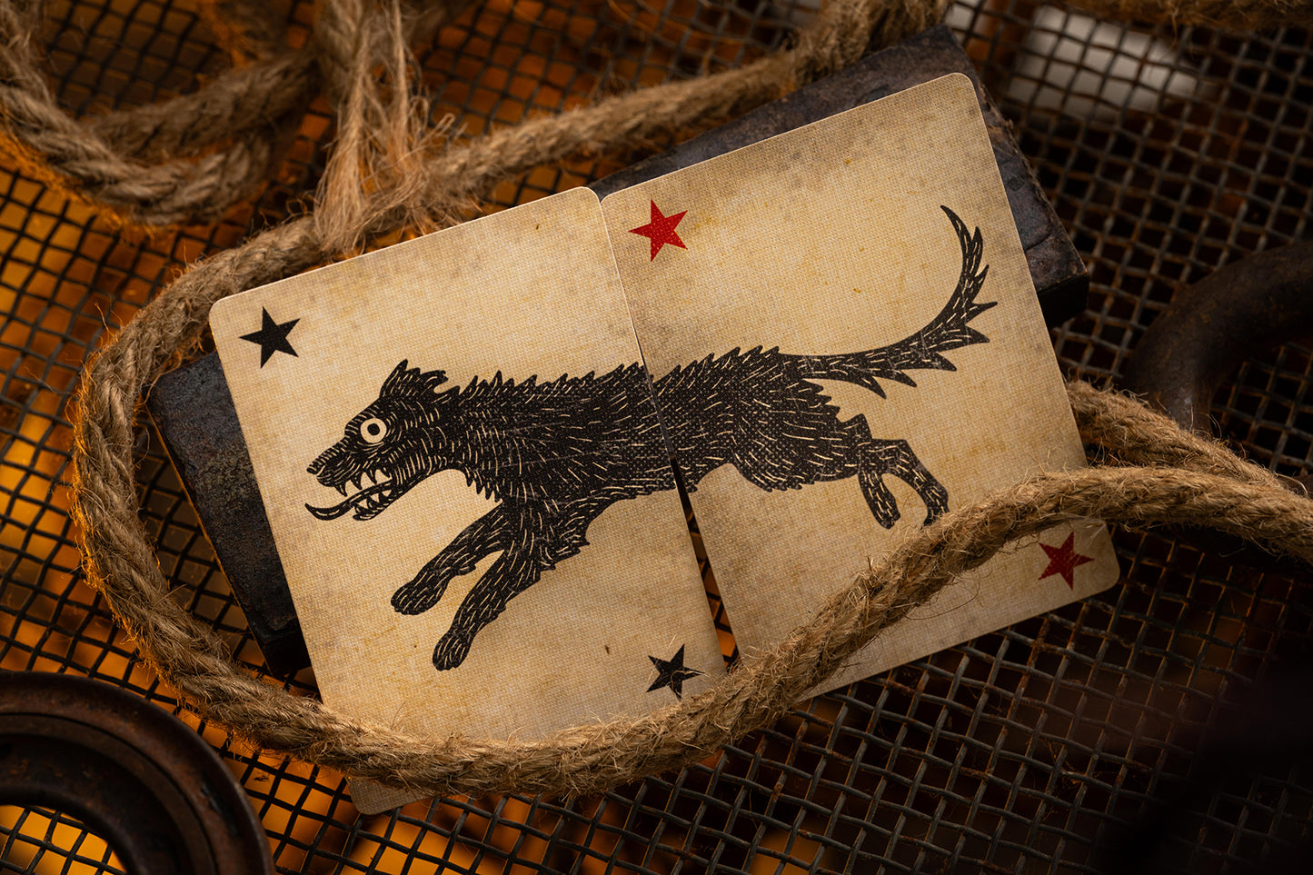 Vintage-style card with a black dog illustration and stars, surrounded by twine.