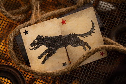 Vintage-style card with a black dog illustration and stars, surrounded by twine.
