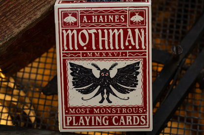 premium playing card tuckbox with Mothman design and text on a textured background - uk playing cards - hand-drawn