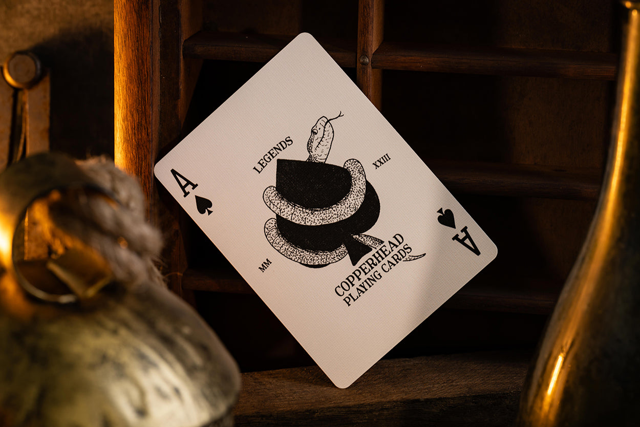 Playing card with a unique ace of spades vintage design on a wooden surface