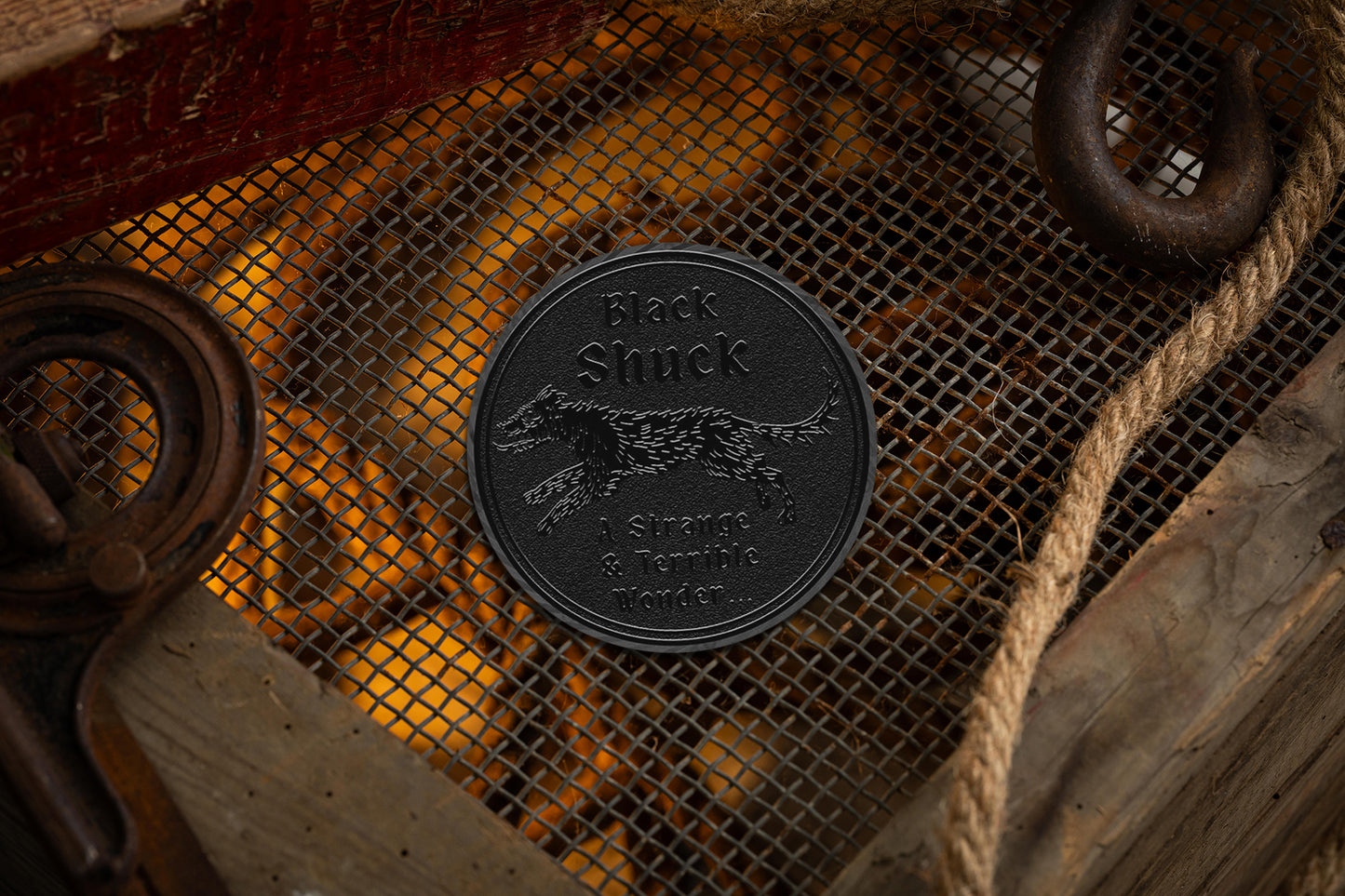 collectable black metal coin with black shuck cryptids iconography | cryptids playing cards | a haines