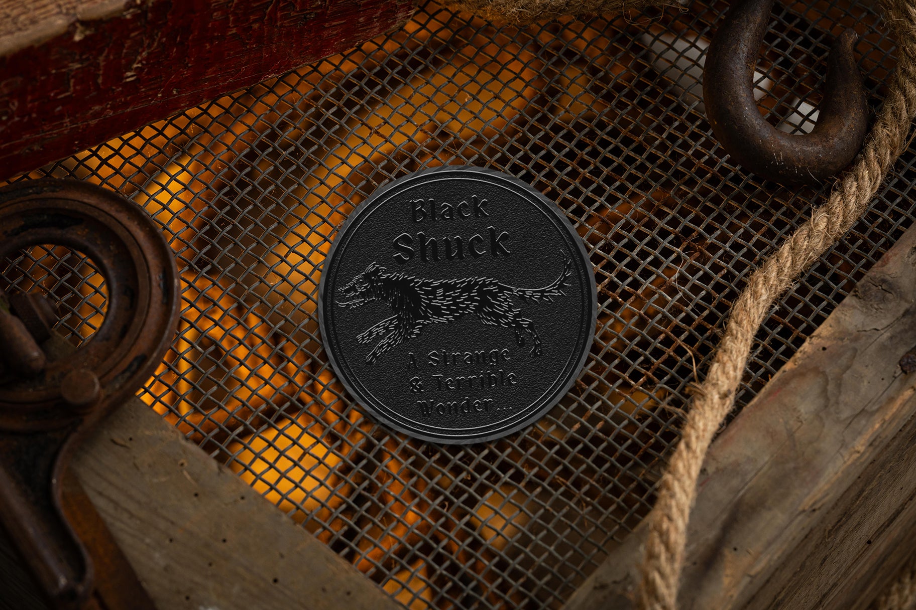 collectable black metal coin with black shuck cryptids iconography | cryptids playing cards | a haines