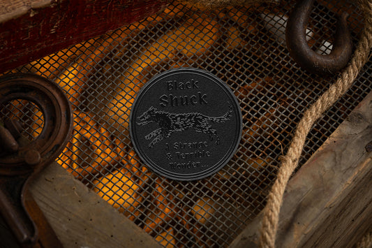 collectable black metal coin with black shuck cryptids iconography | cryptids playing cards | a haines